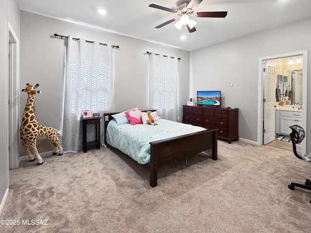 bedroom featuring carpet flooring, a ceiling fan, baseboards, and connected bathroom
