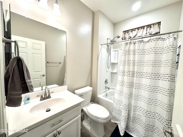 bathroom featuring vanity, shower / bath combo with shower curtain, toilet, and wood finished floors