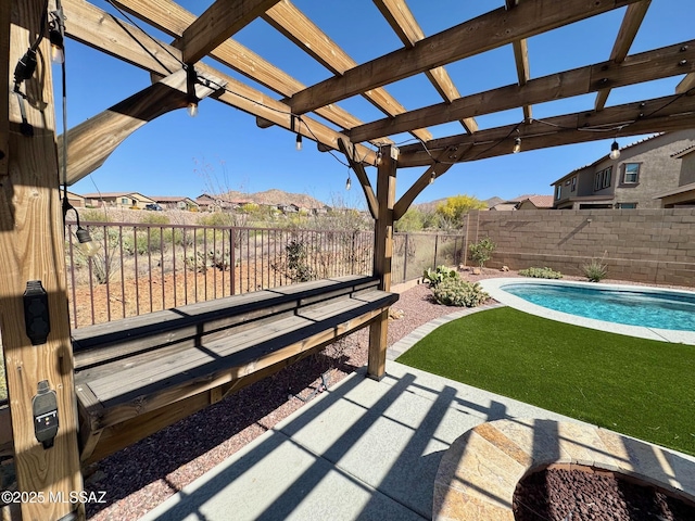view of patio / terrace with a pergola, a fenced in pool, a residential view, and a fenced backyard