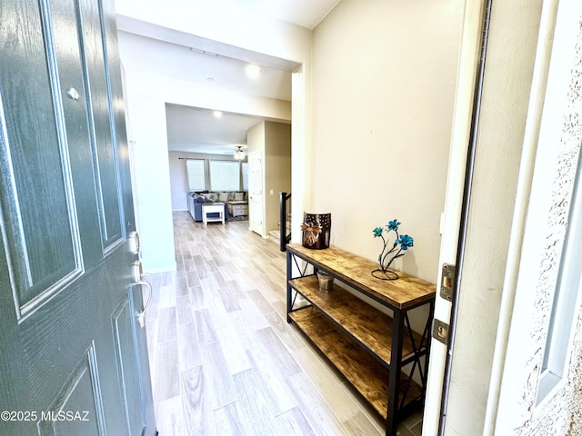 hall with wood finished floors