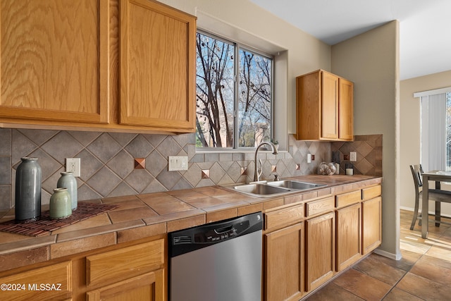 13792 E Langtry Ln, Tucson, AZ 85747 - kitchen featuring baseboards, tile counters, decorative backsplash, stainless steel dishwasher, and a sink