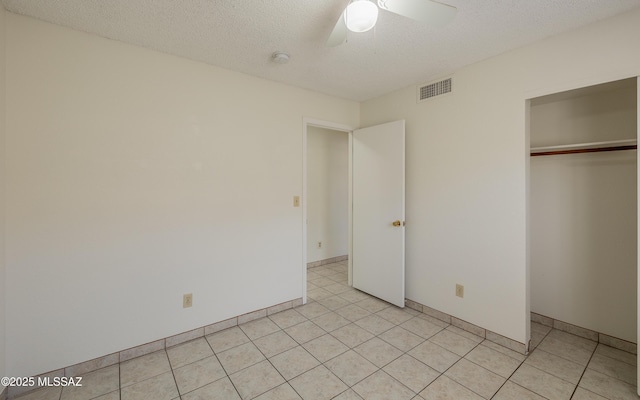 5319 S Via Galapagos, Tucson, AZ 85706 - unfurnished bedroom featuring a closet, a ceiling fan, and a textured ceiling