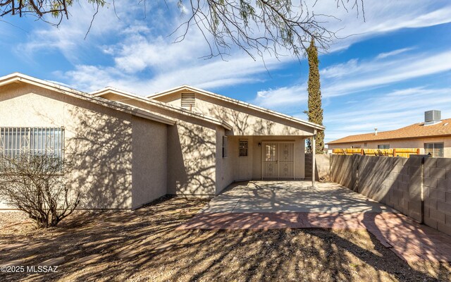 5319 S Via Galapagos, Tucson, AZ 85706 - view of side of home with stucco siding and a patio area