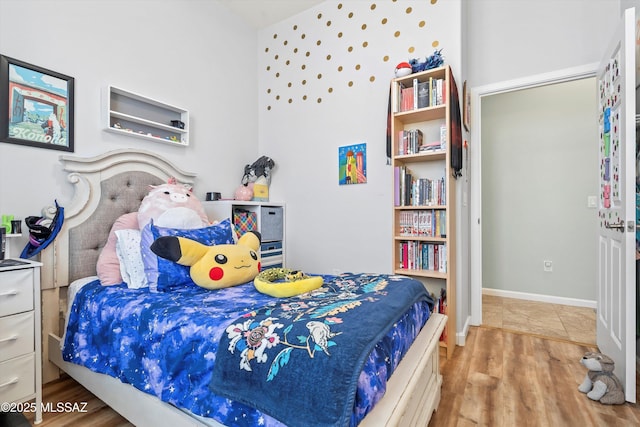 bedroom with wood finished floors