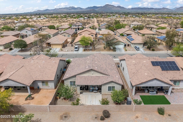 drone / aerial view featuring a residential view and a mountain view