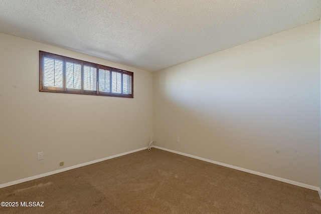7617 E Morelos Pl, Tucson, AZ 85710 - spare room with carpet flooring, baseboards, and a textured ceiling