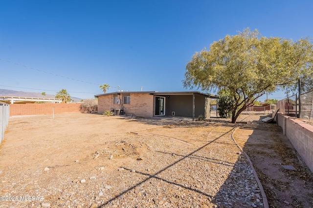 7617 E Morelos Pl, Tucson, AZ 85710 - rear view of house featuring a fenced backyard