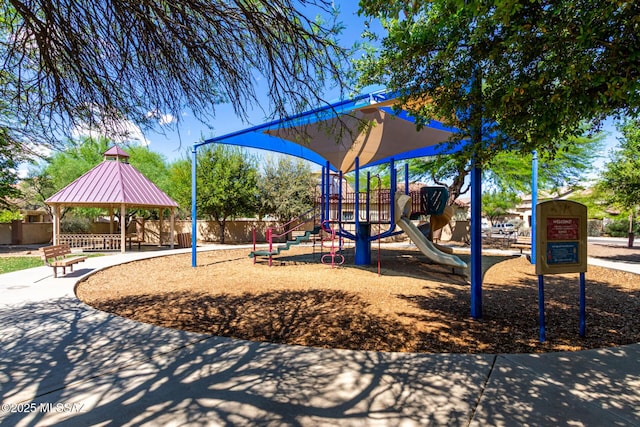 community jungle gym featuring a gazebo and fence