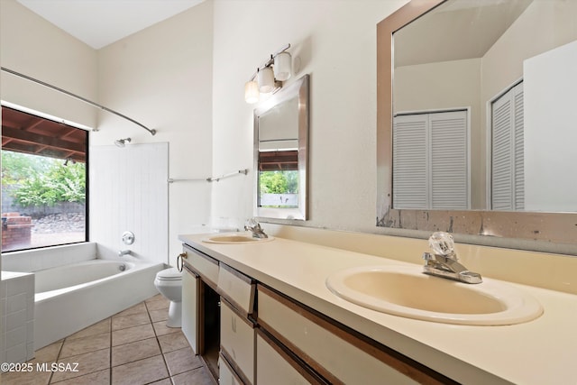 bathroom with a sink, a wealth of natural light, and toilet