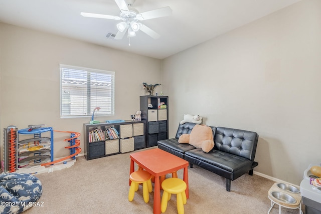 interior space with visible vents, ceiling fan, carpet, and baseboards
