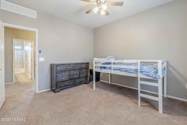 bedroom with carpet flooring, visible vents, baseboards, and a ceiling fan