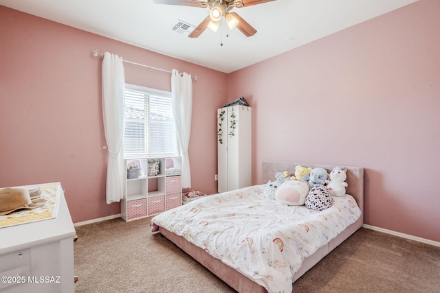 carpeted bedroom with visible vents, baseboards, and ceiling fan