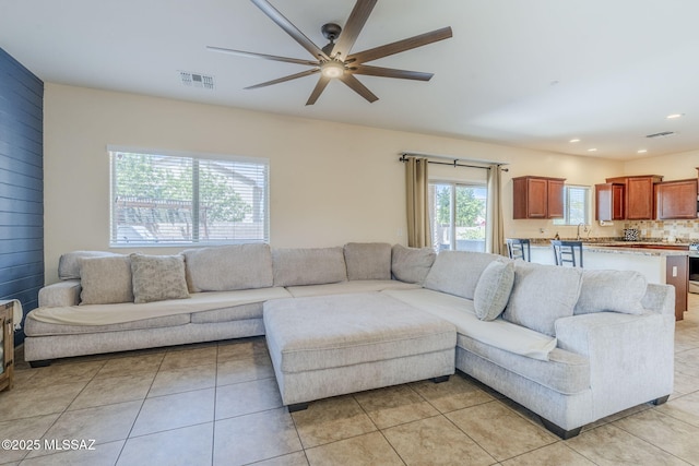 living room featuring visible vents, ceiling fan, recessed lighting, and light tile patterned flooring