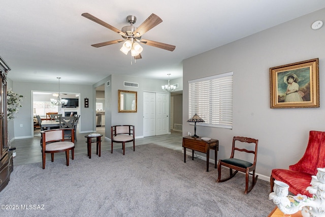 649 W Via, San Mateo, Green Valley, AZ 85614 - living area with visible vents, baseboards, carpet floors, and ceiling fan with notable chandelier