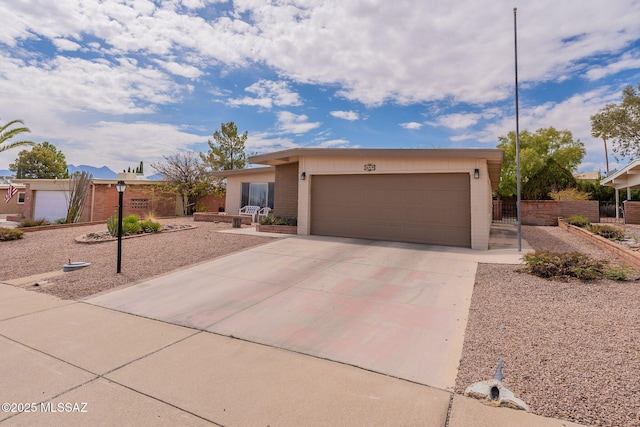 649 W Via, San Mateo, Green Valley, AZ 85614 - view of front facade featuring a garage, fence, and concrete driveway
