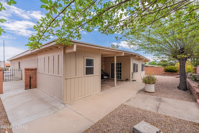 649 W Via, San Mateo, Green Valley, AZ 85614 - rear view of house featuring a patio, board and batten siding, and fence