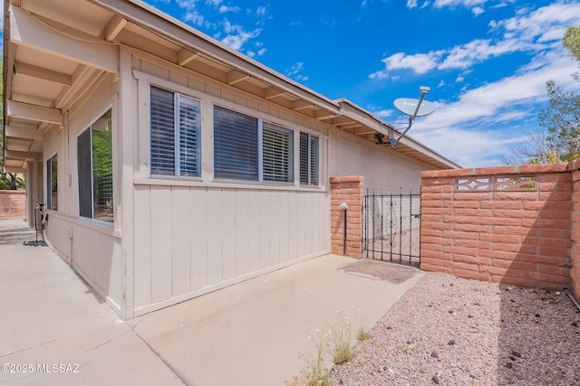 649 W Via, San Mateo, Green Valley, AZ 85614 - view of property exterior with a patio, fence, and a gate