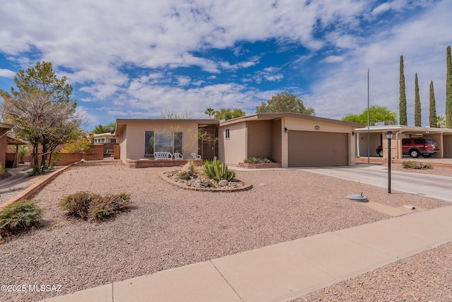 649 W Via, San Mateo, Green Valley, AZ 85614 - view of front facade with a garage, concrete driveway, and brick siding