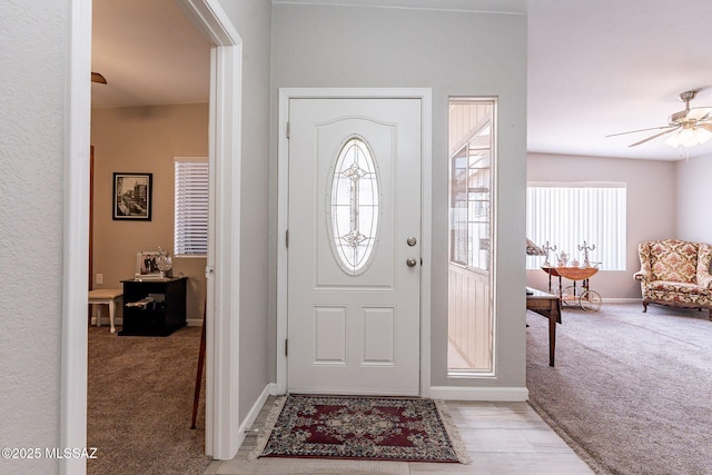 649 W Via, San Mateo, Green Valley, AZ 85614 - foyer featuring baseboards, a ceiling fan, and light carpet
