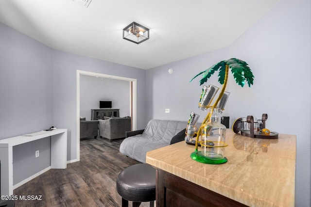 interior space with baseboards and dark wood-style flooring