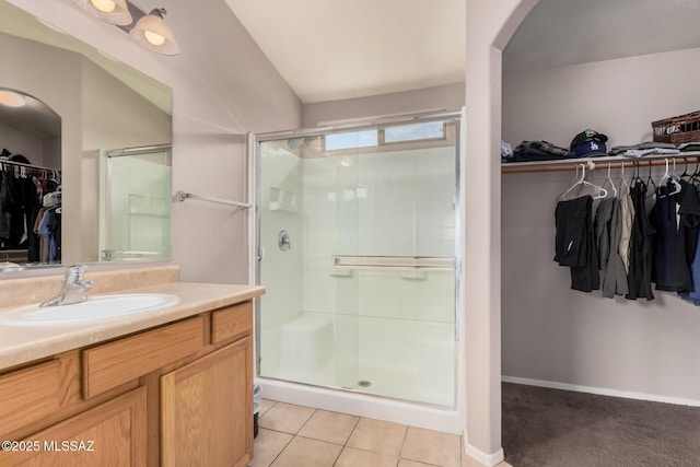 full bathroom with vanity, tile patterned floors, and a stall shower