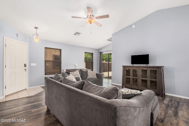 living room with vaulted ceiling, a ceiling fan, wood finished floors, and visible vents