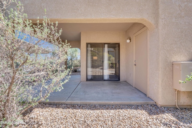101 S Players Club Dr Unit 12103, Tucson, AZ 85745 - property entrance featuring a patio area and stucco siding