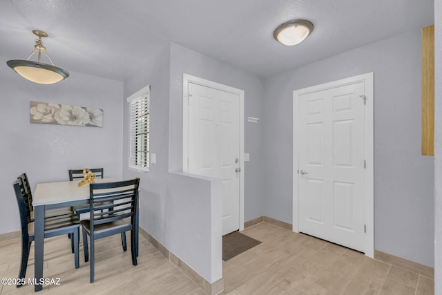 101 S Players Club Dr Unit 12103, Tucson, AZ 85745 - entrance foyer with light wood-type flooring and baseboards