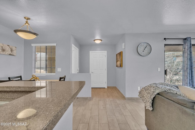 101 S Players Club Dr Unit 12103, Tucson, AZ 85745 - interior space featuring light wood-type flooring, baseboards, and a textured ceiling