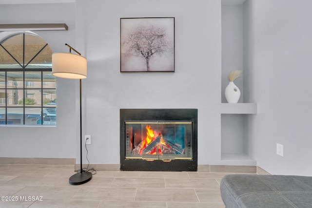 101 S Players Club Dr Unit 12103, Tucson, AZ 85745 - interior details featuring a glass covered fireplace