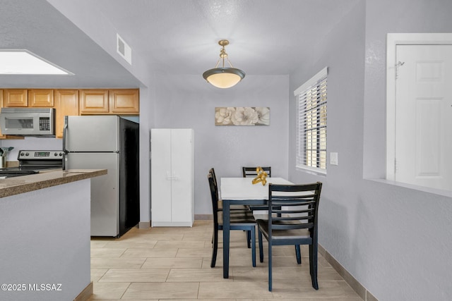 101 S Players Club Dr Unit 12103, Tucson, AZ 85745 - dining room featuring visible vents and baseboards