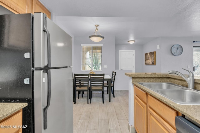 101 S Players Club Dr Unit 12103, Tucson, AZ 85745 - kitchen with light countertops, freestanding refrigerator, a sink, and dishwasher