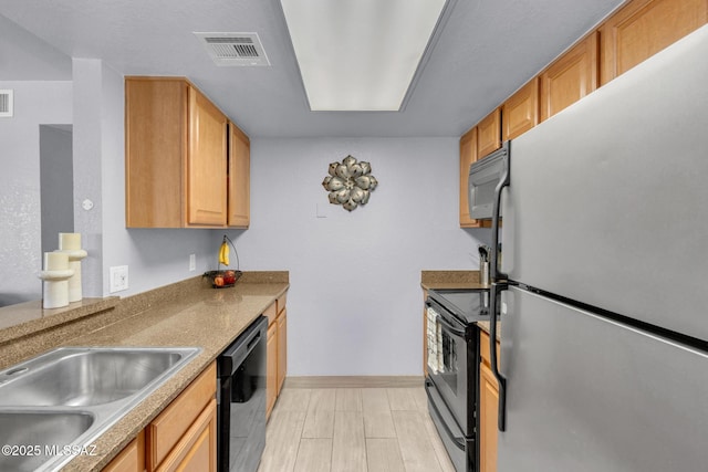101 S Players Club Dr Unit 12103, Tucson, AZ 85745 - kitchen with visible vents, baseboards, and black appliances