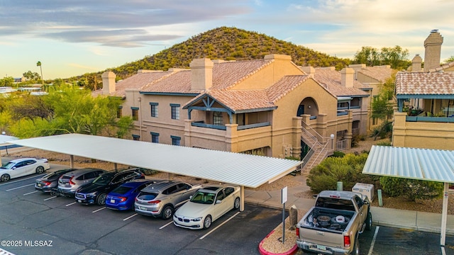 101 S Players Club Dr Unit 12103, Tucson, AZ 85745 - exterior space with a mountain view and covered and uncovered parking
