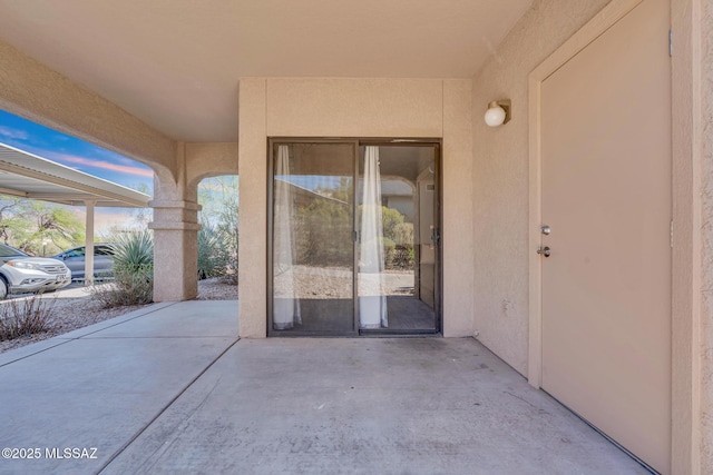 101 S Players Club Dr Unit 12103, Tucson, AZ 85745 - doorway to property with a patio and stucco siding