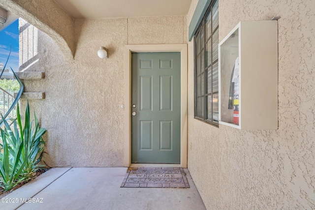 101 S Players Club Dr Unit 12103, Tucson, AZ 85745 - view of exterior entry featuring stucco siding