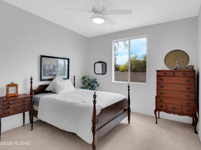 bedroom featuring ceiling fan and light carpet