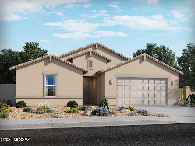 view of front facade featuring an attached garage, concrete driveway, and stucco siding
