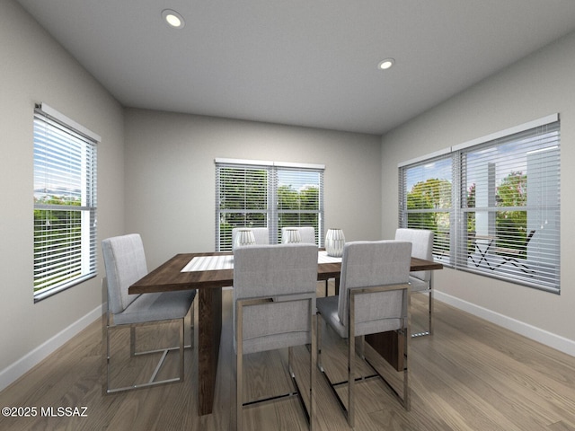 dining space with recessed lighting, baseboards, and wood finished floors