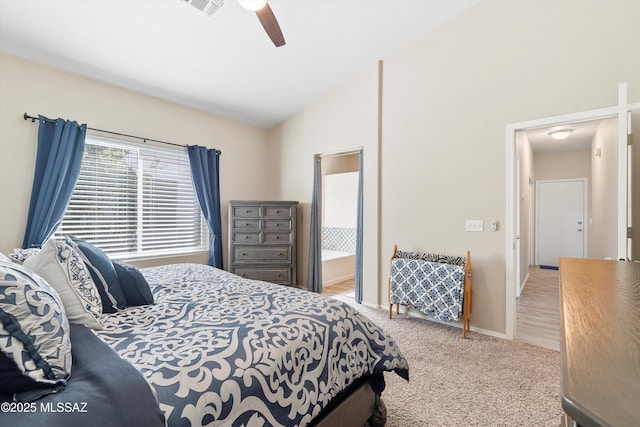 carpeted bedroom featuring lofted ceiling, a ceiling fan, and baseboards