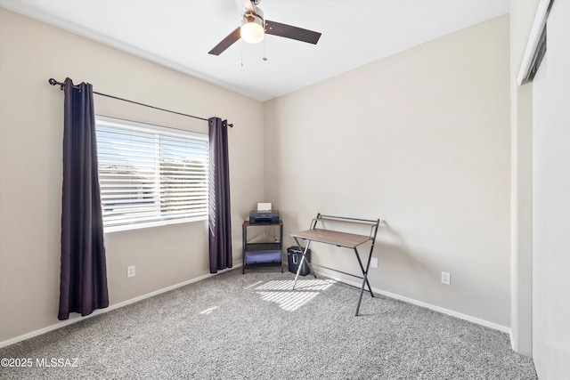 interior space with ceiling fan, baseboards, and carpet flooring