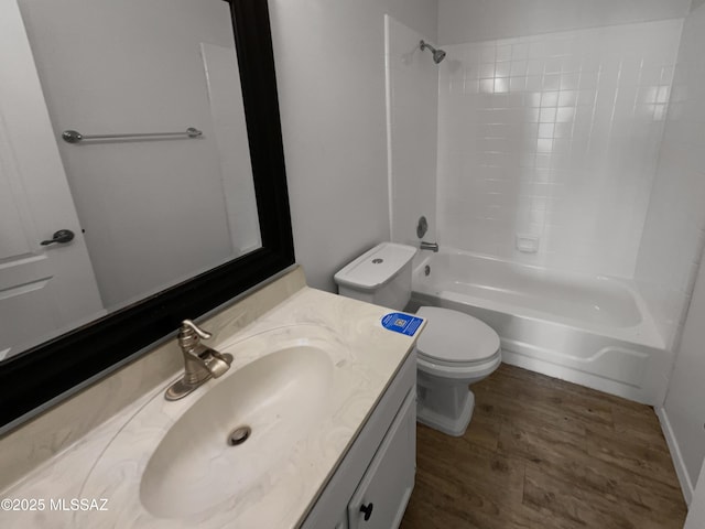 full bathroom featuring vanity, shower / bathing tub combination, toilet, and wood finished floors