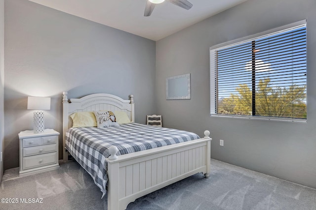 carpeted bedroom featuring a ceiling fan