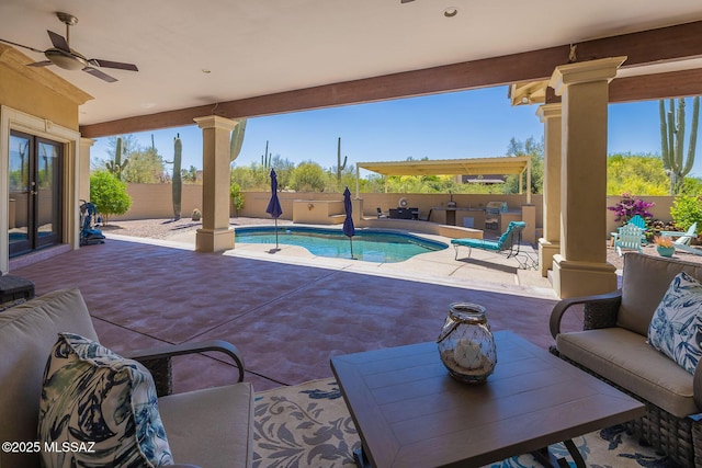 view of swimming pool featuring a fenced in pool, a fenced backyard, a patio area, french doors, and a ceiling fan