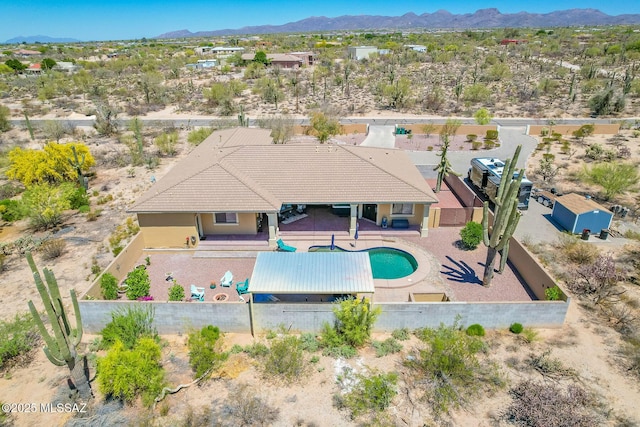 birds eye view of property featuring a mountain view