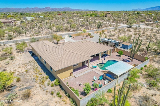 bird's eye view featuring a mountain view and view of desert