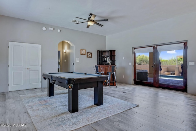 playroom with ceiling fan, visible vents, arched walkways, pool table, and light wood-style floors