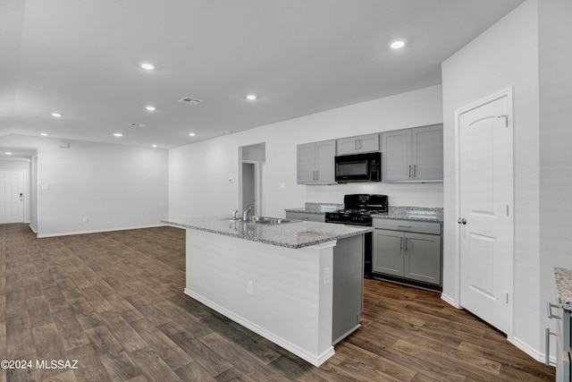 kitchen featuring gray cabinets, dark wood-style flooring, a sink, and black appliances