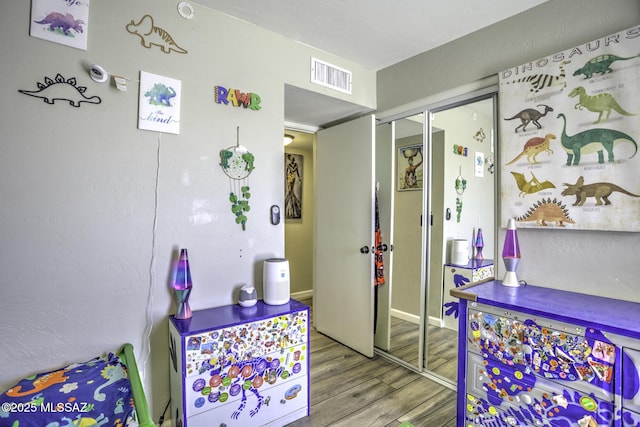 7217 E Fayette St, Tucson, AZ 85730 - rec room with wood finished floors and baseboards