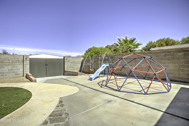 7217 E Fayette St, Tucson, AZ 85730 - view of playground featuring a fenced backyard, a patio area, and a storage shed